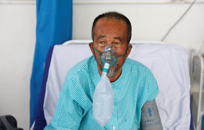 A patient suffering from COVID-19 receives treatment at the Afghan-Japan Hospital in Kabul