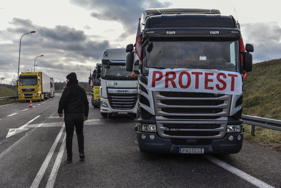 Trucks stand in a queue at the Polish-Ukrainian border in Hrebenne, southeastern Poland (EPA)