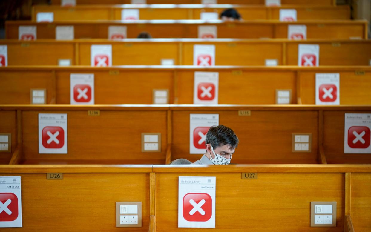 People studying in a socially-distanced reading room at Oxford's Bodleian Libraries ahead of the return of students to universities - Christopher Furlong/Getty Images