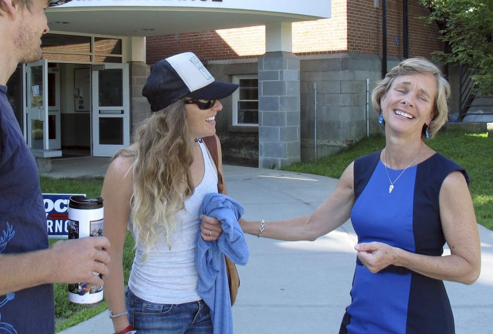  Hans von Briesen, left, and Alix Klein, center, speak with Democrat gubernatorial hopeful Sue Minter outside the polls after Minter cast her ballot in the primary election Tuesday Aug. 9, 2016, in Waterbury, Vt. Minter is one of five candidates vying for the Democratic nomination. Democrat Gov. Peter Shumlin is not seeking re-election in November. (Photo: Wilson Ring/AP)