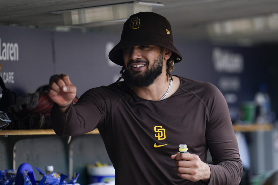 San Diego Padres' Fernando Tatis Jr. smiles in the dugout against the Detroit Tigers in the seventh inning of a baseball game in Detroit, Wednesday, July 27, 2022. (AP Photo/Paul Sancya)