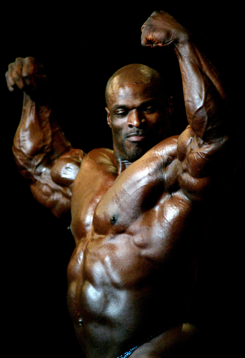 Mr. Olympia Winner Ronnie Coleman flexes his muscles.