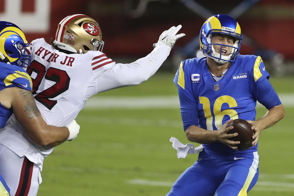 San Francisco 49ers defensive end Kerry Hyder Jr., left, applies pressure to Los Angeles Rams quarterback Jared Goff (16) during the second half of an NFL football game in Santa Clara, Calif., Sunday, Oct. 18, 2020. (AP Photo/Jed Jacobsohn)