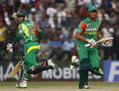 Bangladesh's Anamul Haque and captain Mushfiqur Rahim (L) run between the wickets during their Asia Cup 2014 one-day international (ODI) cricket match against India in Fatullah February 26, 2014.