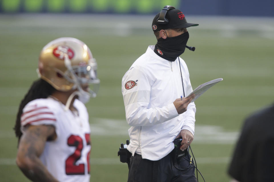 FILE - San Francisco 49ers head coach Kyle Shanahan stands on the sideline during the second half of an NFL football game against the Seattle Seahawks in Seattle, in this Sunday, Nov. 1, 2020, file photo. The 49ers are set to embark on an unusual three-week road trip after being kicked out of their home stadium and practice facility because of strict new COVID-19 protocols in their home county. (AP Photo/Scott Eklund, File)