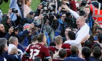 Britain Football Soccer - Burnley v Queens Park Rangers - Sky Bet Football League Championship - Turf Moor - 2/5/16 Burnley manager Sean Dyche celebrates promotion to the premier league with their players Mandatory Credit: Action Images / Jason Cairnduff Livepic