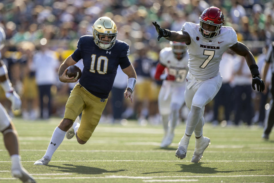 Notre Dame quarterback Drew Pyne (10) runs the ball toward the end zone during the second quarter of an NCAA college football game against UNLV, Saturday, Oct. 22, 2022, in South Bend, Ind. (AP Photo/Marc Lebryk)