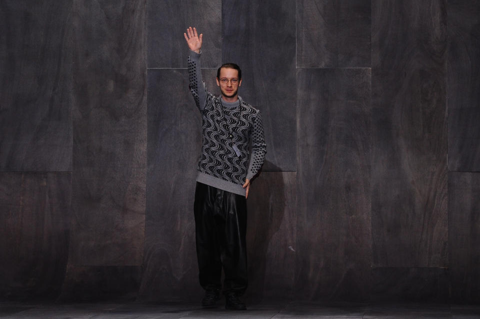 Fashion designer Damir Doma greats the audience at the end of his fall-winter 2013/2014 men's fashion collection, in Paris, Saturday, Jan. 19, 2013. (AP Photo/Zacharie Scheurer)