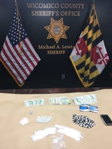 Items allegedly seized from Monica Snee’s car which included heroin, Oxycodone and cash.