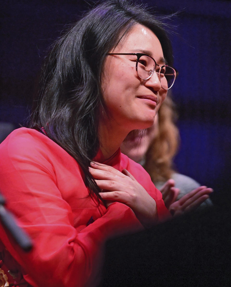 St. Paul Councilwoman HwaJeong Kim acknowledges her supporters after her oath of office during the inauguration ceremony for St. Paul City Council members in St. Paul, Minn. on Tuesday, Jan. 9, 2024. The youngest and most diverse city council in the history of Minnesota's capital city was sworn into office Tuesday, officially elevating the first all-female St. Paul City Council into public service at City Hall. (John Autey /Pioneer Press via AP)