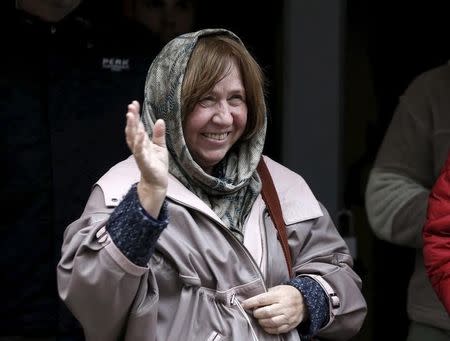 Belarussian author Svetlana Alexievich waves to the public after attending a news conference in Minsk, Belarus, October 8, 2015. REUTERS/Vasily Fedosenko