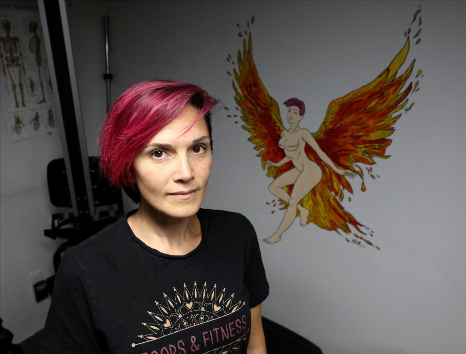 Rori Zura, 36, once had a video removed because of artwork in the background, which was a nude illustration of Zura as a survivor, wearing wings of fire.