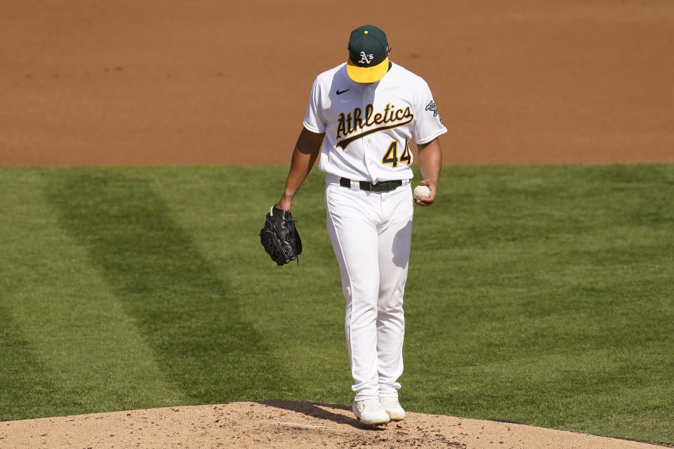 Oakland Athletics pitcher Jesus Luzardo reacts after allowing a solo home run against Chicago White Sox's Adam Engel during the second inning of Game 1 of an American League wild-card baseball series Tuesday, Sept. 29, 2020, in Oakland, Calif. (AP Photo/Eric Risberg)