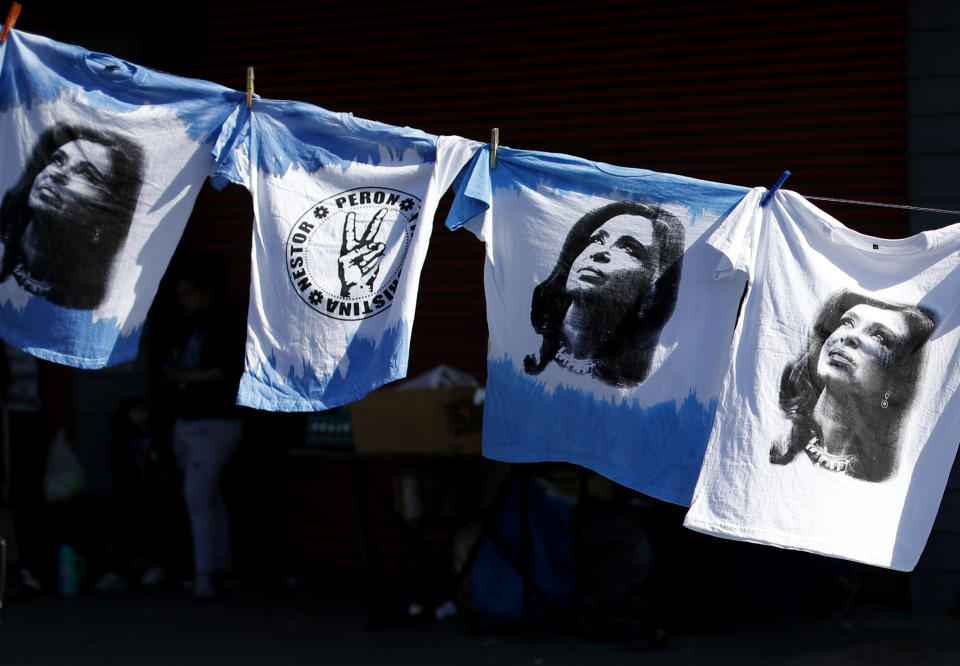 FILE - This Sept. 21, 2019 file photo shows T-shirts emblazoned with an image of former President Cristina Fernandez displayed for sale in Buenos Aires, Argentina. Fernandez is now running as vice president in a ticket that is likely to beat Argentina's current President Mauricio Macri, who won his first term with the support of the key farming sector. (AP Photo/Natacha Pisarenko, File)