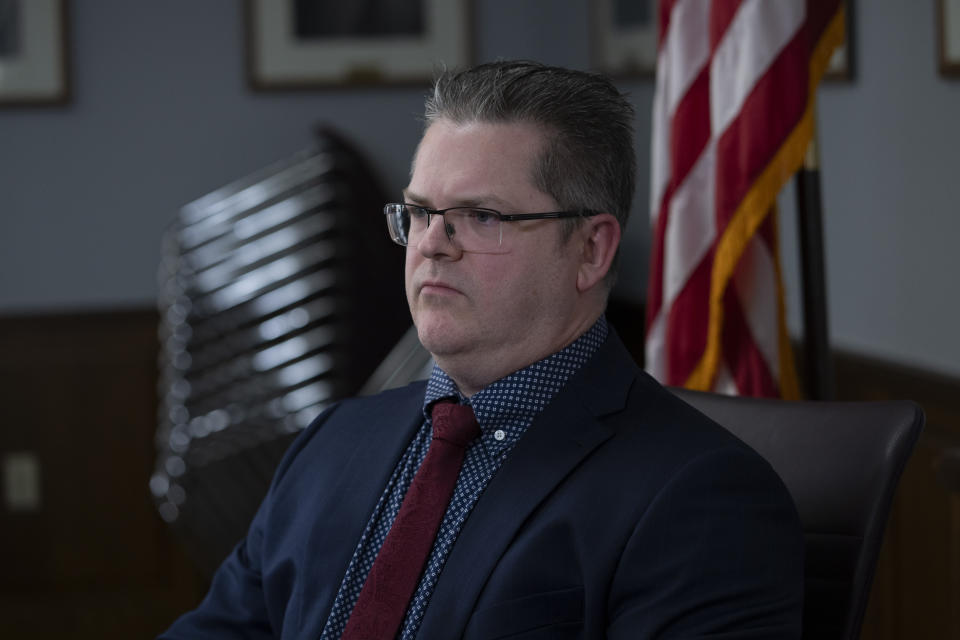 Michael Moore, chief information security officer at the office of the Arizona Secretary of State, listens during an interview with the Associated Press in Phoenix, Monday, March 4, 2024. (AP Photo/Serkan Gurbuz)