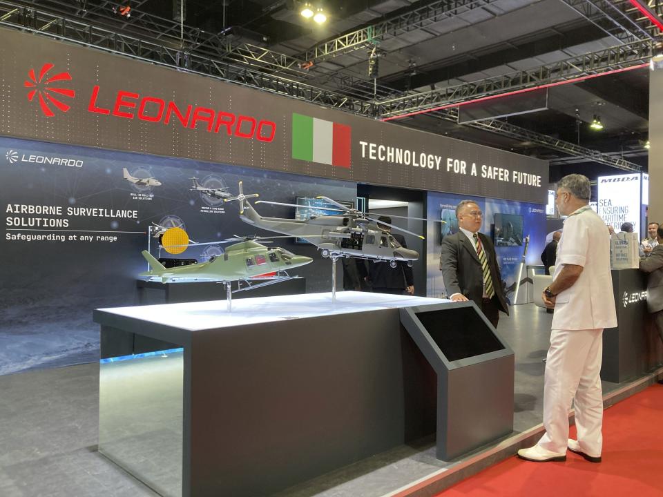 Malaysian military personnel stand at the booth of Leonardo, a company that specializes in aerospace, defense, and security, at the Defense Services Asia (DSA) exhibition in Kuala Lumpur, Malaysia Tuesday, May 7, 2024. (AP Photo/Syawalludin Zain)