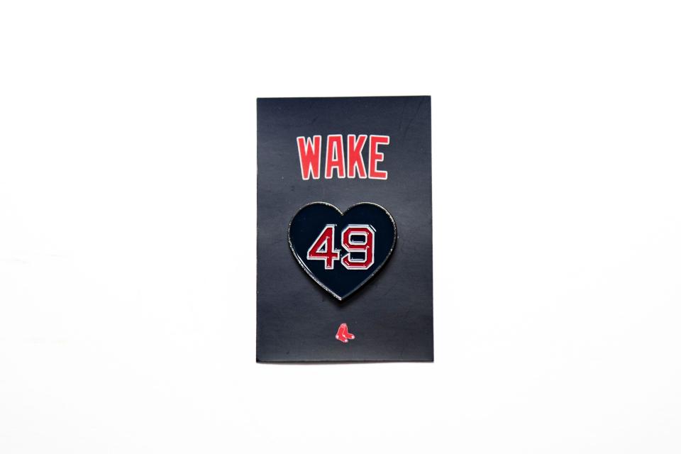 All fans attending the Boston Red Sox home opener on Tuesday, April 9, will receive this commemorative pin honoring Tim Wakefield, who died of brain cancer in October 2023.