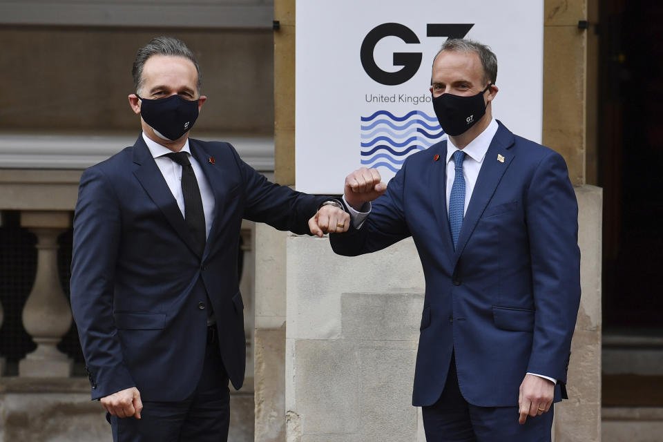 German Foreign Affairs Minister Heiko Maas, left, is greeted by Britain's Foreign Secretary Dominic Raab at the start of the G7 foreign ministers meeting in London Tuesday May 4, 2021. G7 foreign ministers meet in London Tuesday for their first face-to-face talks in more than two years. (Ben Stansall / Pool via AP)