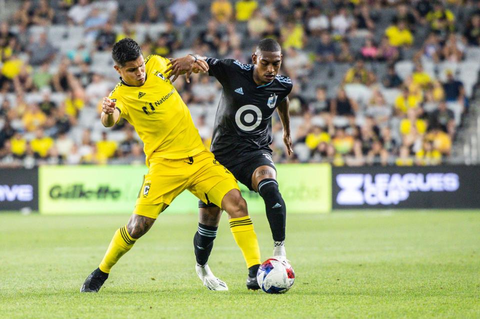 Aug 4, 2023; Columbus, OH, USA;  Columbus Crew forward Cucho Hernandez (9) tackles the ball away from Minnesota United midfielder Joseph Rosales (8) in the second half at Lower.com Field. Mandatory Credit: Trevor Ruszkowski-USA TODAY Sports