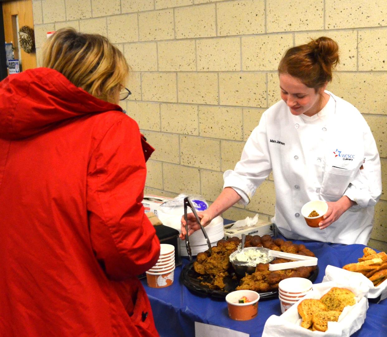 A Culinary Arts student at the Wayne County Schools Career Center serves a guest at a previous Annual Tailgate Party. This year’s event will take place on Wednesday, November 21 from 11am to 1:30pm. Donations taken at the door will benefit the Career Center’s Culinary Arts and Hospitality programs.