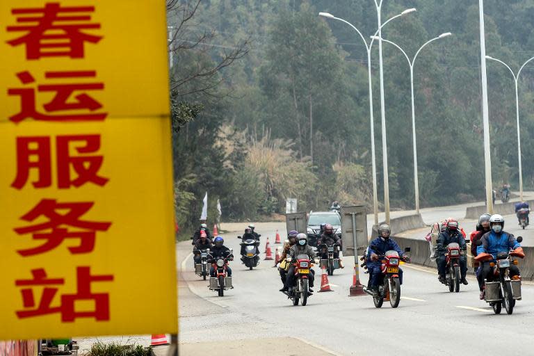 A group of Chinese travellers arriving on their motorcycles at a pitstop in Wuzhou, Guangxi province, on January 25, 2014