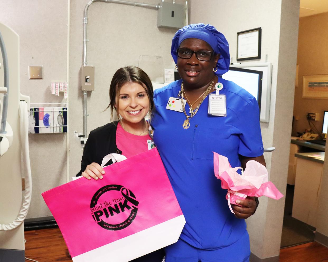 Mammography Tech Aly Nevil gives Antoinette White a gift bag and succulent as a thank you for getting her screening on Mammography Day.