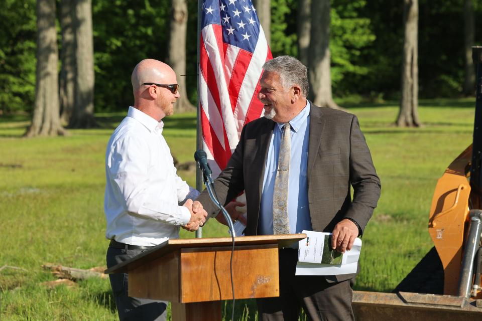 Greg Mytinger, left, director of parks and recreation, introduces Mayor Glenn Broska at the groundbreaking ceremony Thursday for the new community center in Streetsboro City Park.