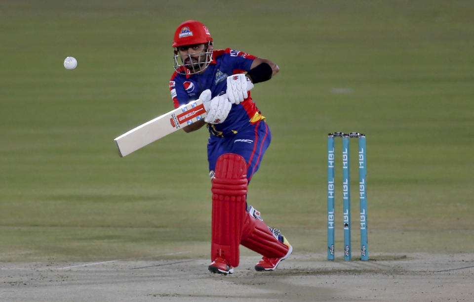 Karachi Kings' Babar Azam plays a shot during a Pakistan Super League T20 cricket match between Karachi Kings and Islamabad United at the National Stadium, in Karachi, Pakistan, Wednesday, Feb. 24, 2021. (AP Photo/Fareed Khan)