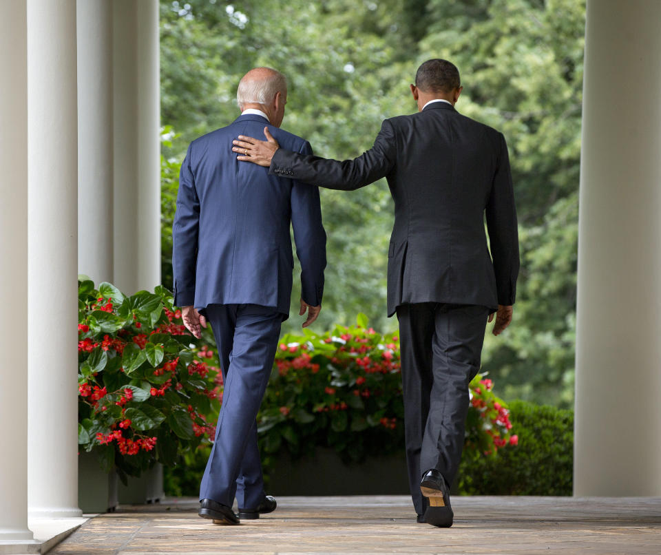 President Barack Obama walks with Vice President Joe Biden back to the Oval Office of the White House in Washington, Thursday, June 25, 2015, after speaking in the Rose Garden. (AP Photo/Pablo Martinez Monsivais)