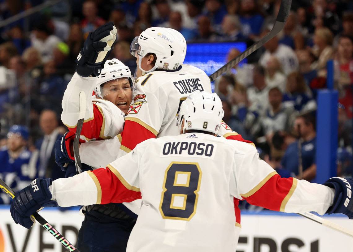 Apr 25, 2024; Tampa, Florida, USA; Florida Panthers defenseman Brandon Montour (62) is congratulated by center Nick Cousins (21), right wing Kyle Okposo (8) and defenseman Oliver Ekman-Larsson (91) after he scored a goal against the Tampa Bay Lightning during the second period in game three of the first round of the 2024 Stanley Cup Playoffs at Amalie Arena. Kim Klement Neitzel/USA TODAY Sports