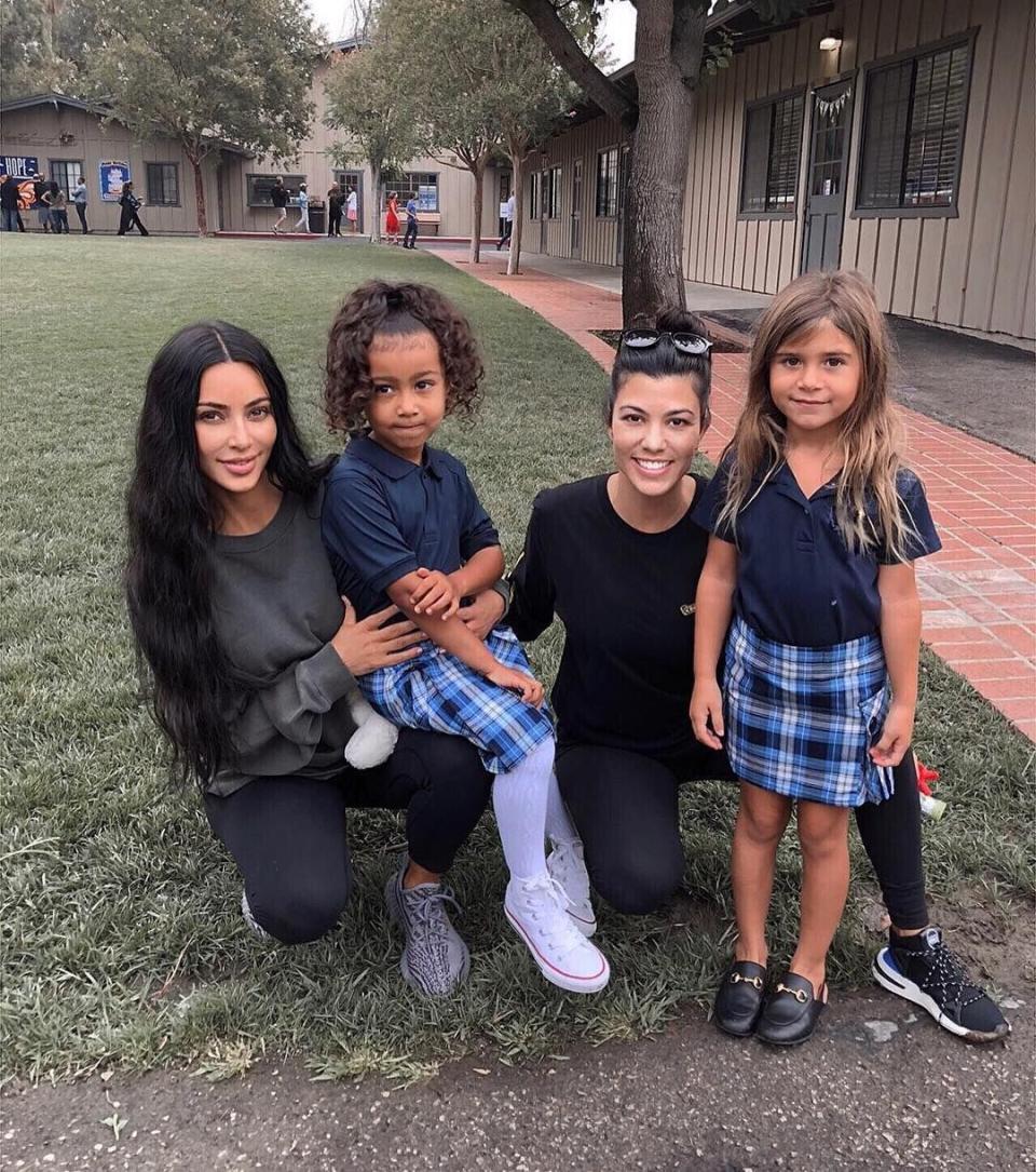 Kim, Kourtney Kardashian with North West and Penelope in Gucci shoes