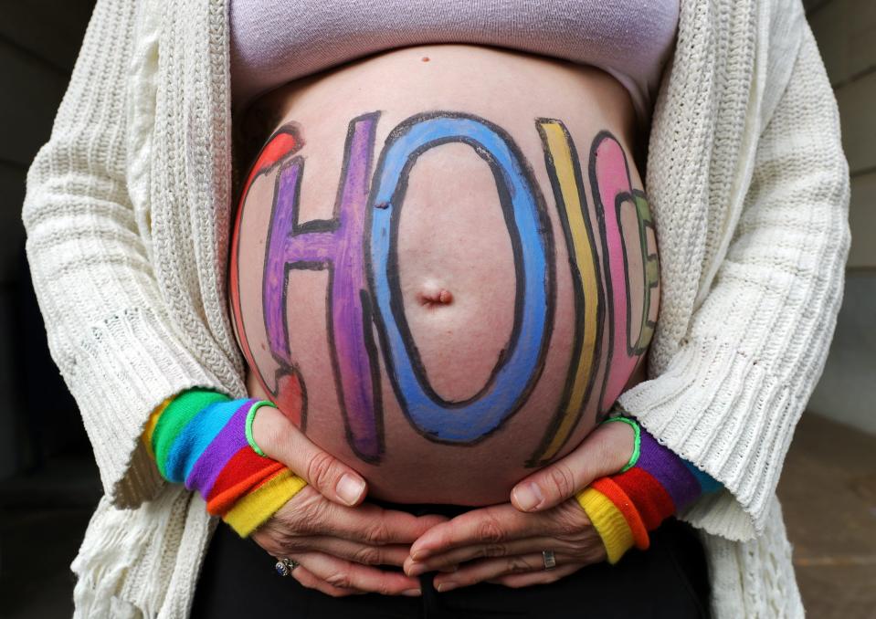 Beth Vild, COO of Big Love Akron, celebrates her choice to have a family during the Bans Off Akron rally for reproductive rights outside Akron City Hall, Sunday, Oct. 8, 2023, in Akron, Ohio.