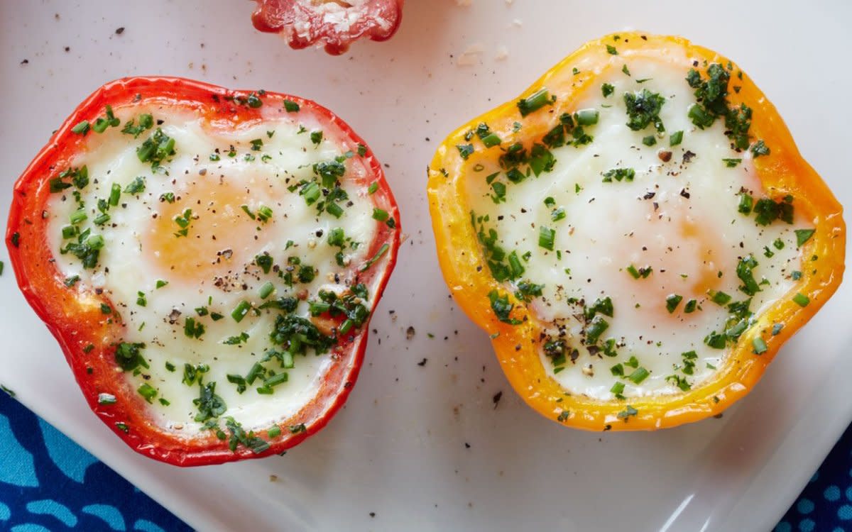 <p>Pepper Eggs-in-a-Hole make breakfast a party and give new meaning to the idea of stuffed peppers. Not only is this baked eggs in peppers recipe low-carb, but it couldn't be easier to make.</p><p><strong>Get the recipe: <a href="https://parade.com/51028/dash/eggs-in-pepper-cups/" rel="nofollow noopener" target="_blank" data-ylk="slk:Eggs in Pepper Cups;elm:context_link;itc:0;sec:content-canvas" class="link rapid-noclick-resp">Eggs in Pepper Cups</a></strong></p>