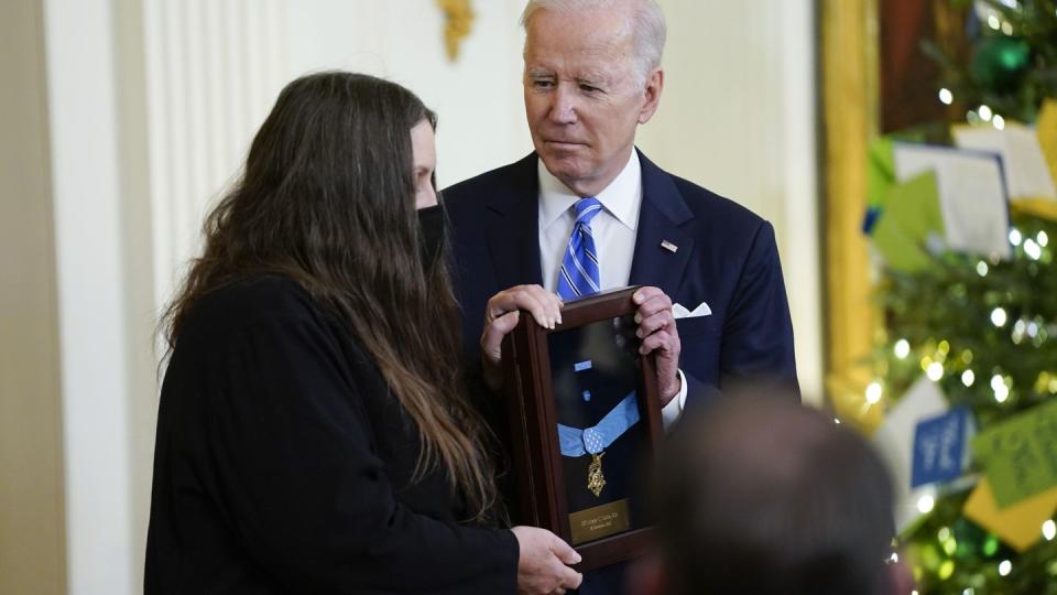 President Joe Biden presents the Medal of Honor to Army Sgt. First Class Alwyn C. Cashe for his actions in Iraq on Oct. 17, 2005, as his widow Tamara Cashe accepts the posthumous recognition. (AP Photo/Evan Vucci)