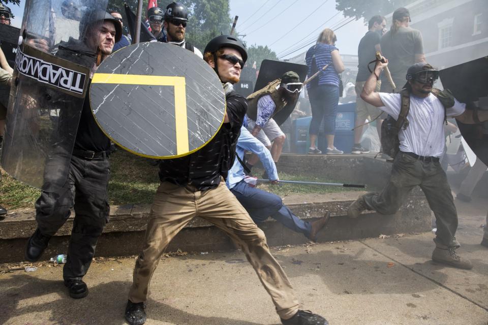 White supremacists rush forward with shields and sticks during clashes with counter-protesters at Emancipation Park in Charlottesville, Virginia, on Saturday. (Photo: Anadolu Agency via Getty Images)