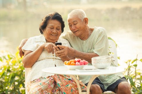 <span class="caption">Social isolation is not new to many elderly people, technology can help alleviate some of the feelings of loneliness</span> <span class="attribution"><a class="link " href="https://www.shutterstock.com/image-photo/happy-asian-senior-couple-using-mobile-192079334" rel="nofollow noopener" target="_blank" data-ylk="slk:WitthayaP/Shutterstock;elm:context_link;itc:0;sec:content-canvas">WitthayaP/Shutterstock</a></span>