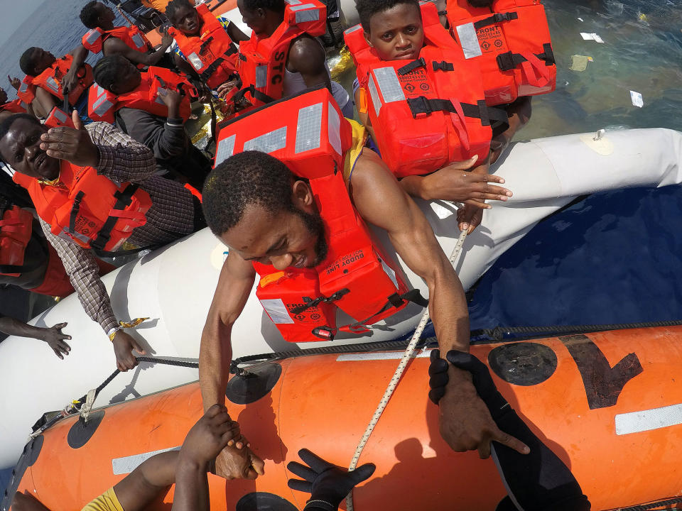 Migrants on a dinghy are rescued by Save the Children NGO crew from the ship 'Vos Hestia' off the coast of Libya, 17 June 2017: Reuters