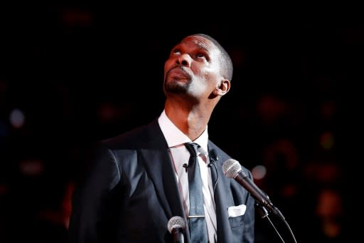 Former Miami Heat player Chris Bosh watches his jersey as it is raised to the rafters during his jersey retirement ceremony at halftime of the game between the Miami Heat and the Orlando Magic