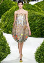 <b>Christian Dior SS13</b> <br><br>This sweet, sheer floral-printed dress featured a bell-skirt.<br><br>© Rex