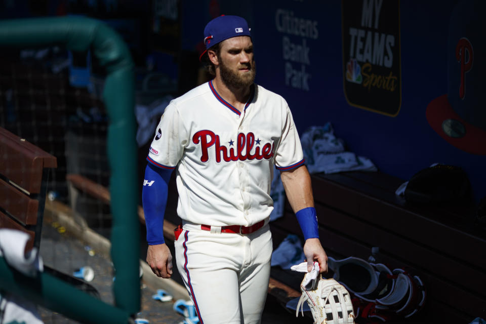 Philadelphia Phillies' Bryce Harper walks through the dugout after a baseball game against the Miami Marlins, Sunday, June 23, 2019, in Philadelphia. (AP Photo/Matt Slocum)