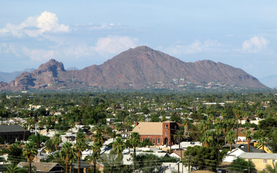 This undated image provided by the Greater Phoenix Convention & Visitors Bureau shows Camelback Mountain located between Phoenix and Scottsdale, Ariz. One of the area’s most popular views is from the top of the red, sandstone landmark, which rises 2,704 feet above sea level. It’s one of a number of free things to do and see in the Phoenix area. (AP Photo/Greater Phoenix Convention & Visitors Bureau)