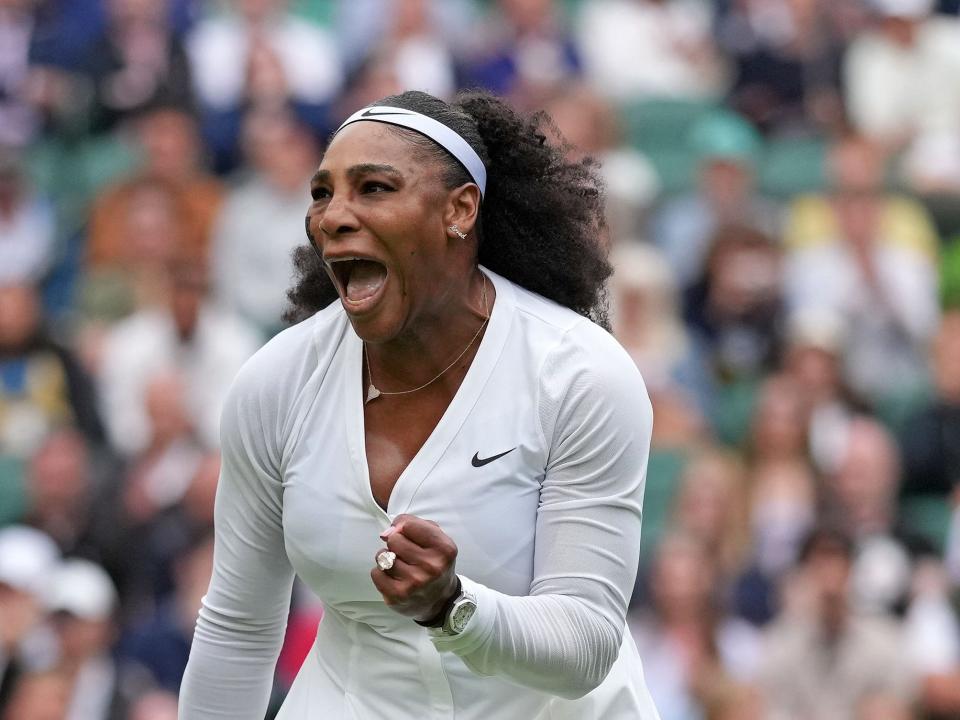 Serena Williams of the US celebrates after winning a point against France's Harmony Tan at Wimbledon 2022.