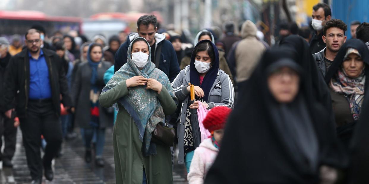 Iranian women wear protective masks to prevent contracting a coronavirus, as they walk at Grand Bazaar in Tehran, Iran February 20, 2020. WANA (West Asia News Agency)/Nazanin Tabatabaee via REUTERS