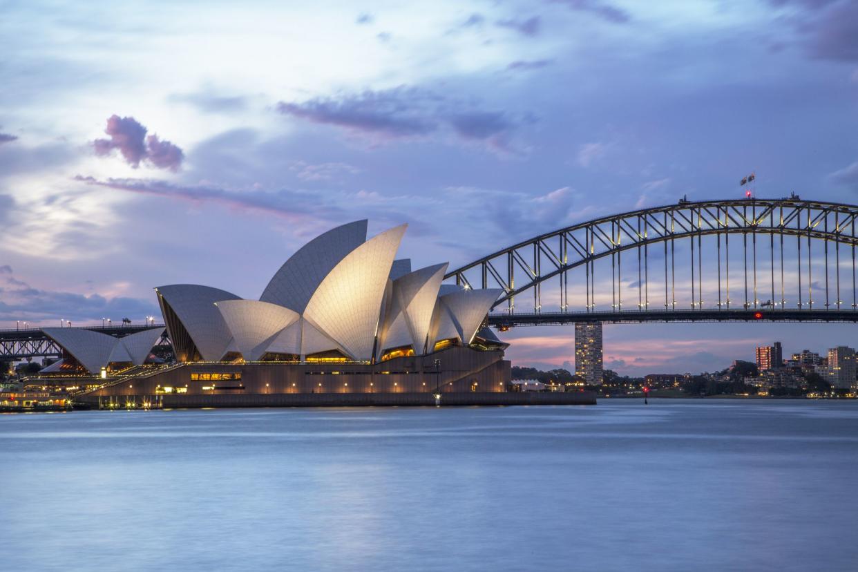 Sydney, NSW, Australia - November 2, 2015: Sydney Opera House and Sydney Harbour Bridge illuminated at dusk