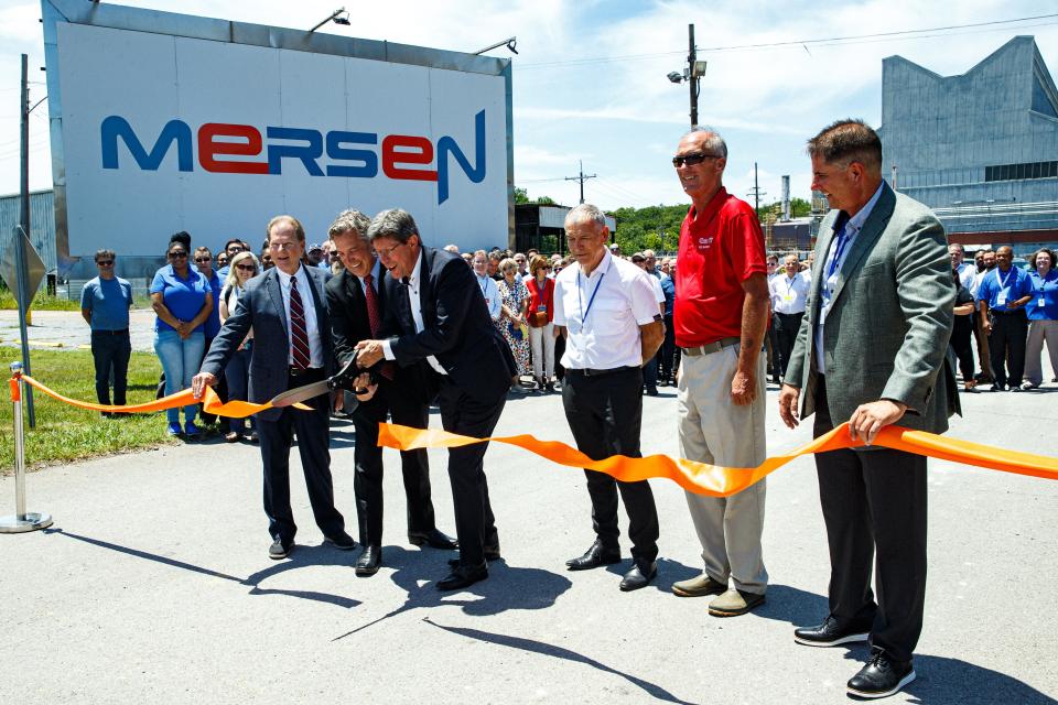 Executives of Mersen as well as politicians from Maury County cut a ribbon to commemorate the opening of the new Mersen location in Columbia, Tenn. on Tuesday, July 11, 2023. (Left) Sen. Joey Hensley, R-Hohenwald; U.S. Rep. Andy Ogles, R-Tennessee, 5th Congressional District; Eric Gaujioty, Mersen Executive Vice President; Mersen CEO Luc Themelin; Columbia Vice Mayor Randy McBroom and Mersen Columbia-based General Manager Lance Butler cut the ribbon during a celebration of the $70 million expansion of France-based company Mersen, a producer of graphite, on Santa Fe Pike in Columbia.