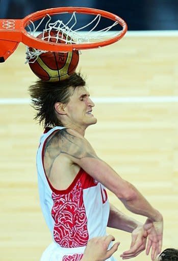 Russian forward Andrei Kirilenko scores against Lithuania during their London 2012 Olympic Games men's quarterfinal basketball match in London. Kirilenko scored 19 points and grabbed 12 rebounds to lead Russia over Lithuania 83-74 and into the semi-finals of the Olympic men's basketball tournament on Wednesday