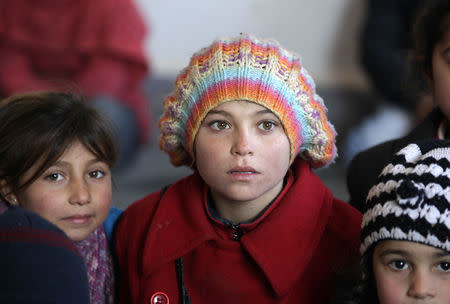 Students attend a class at the 'Aisha Mother of the BelieversÕ school which was recently reopened after rebels took control of al-Rai town from Islamic State militants, Syria January 16, 2017. Picture taken January 16, 2017. REUTERS/Khalil Ashawi