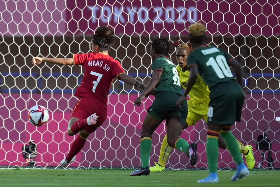 China's Wang Shuang (7) kicks a goal during a women's soccer match against Zambia at the 2020 Summer Olympics, Saturday, July 24, 2021, in Miyagi, Japan. (AP Photo/Andre Penner)