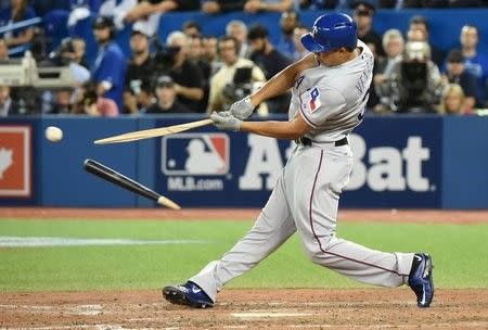 Oct 9, 2015; Toronto, Ontario, CAN; Texas Rangers designated hitter Will Venable hits a broken bat single against the Toronto Blue Jays in the 13th inning in game two of the ALDS at Rogers Centre. Mandatory Credit: Dan Hamilton-USA TODAY Sports