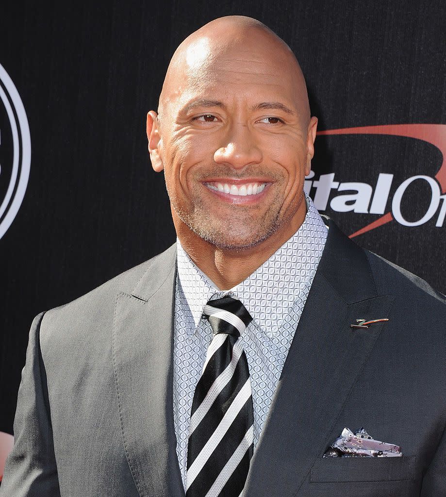 <p>Not only is The Rock—somehow—even better looking bald, he also—somehow—pulls off the stubbled goatee. Not an easy feat. </p>